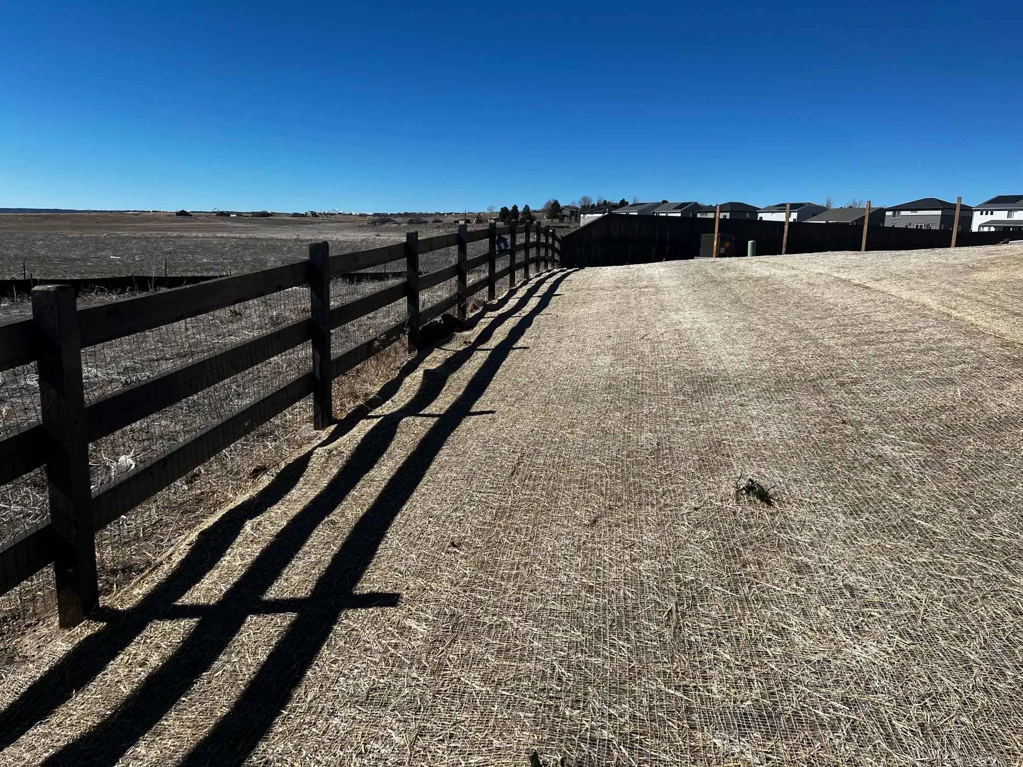 Cedar split rail fence along a property line