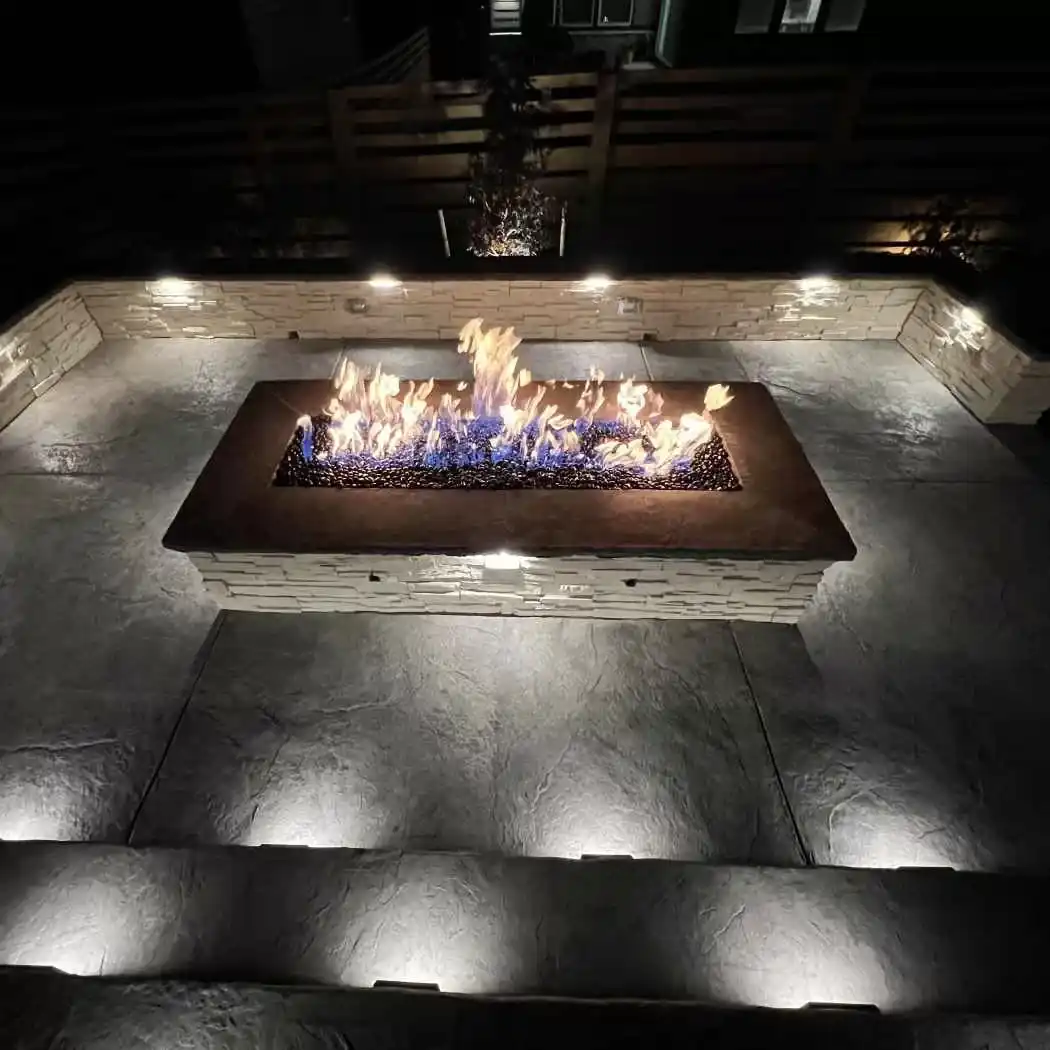 Built-in fire pit with a stone seating area